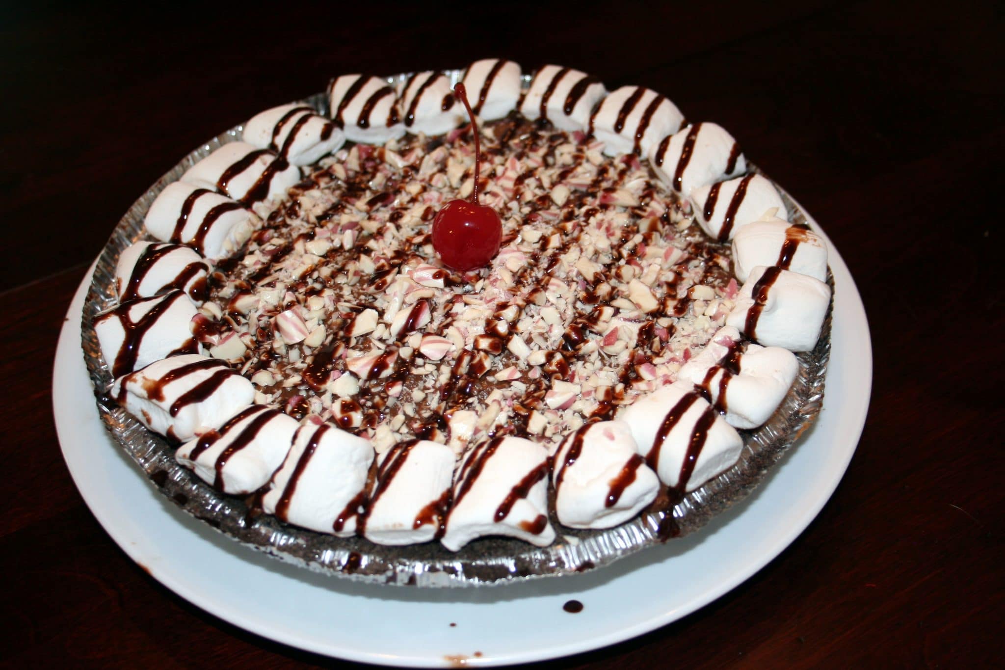 Plate of Vegan Chocolate Cream Pie with cherry on top